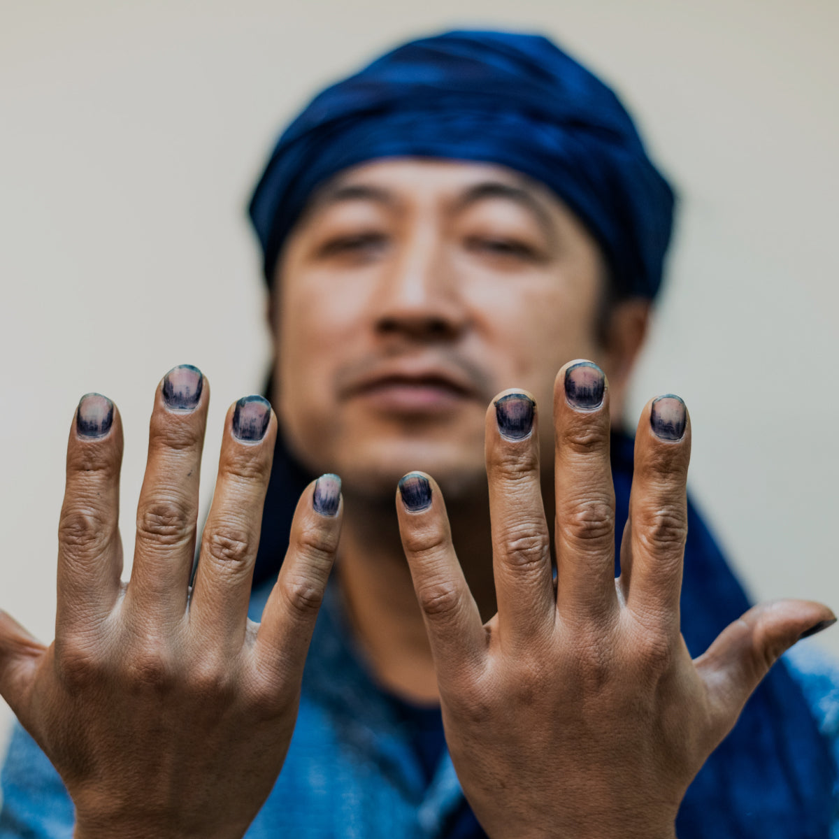 Cozo Cazame showing his with natrual indigo coloured nails